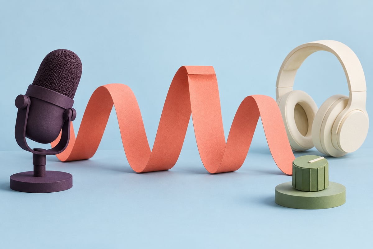 Conceptual plum microphone beside a coral paper ribbon with rounded and folded crests, separate cream headphones and a sage knob on pale blue.